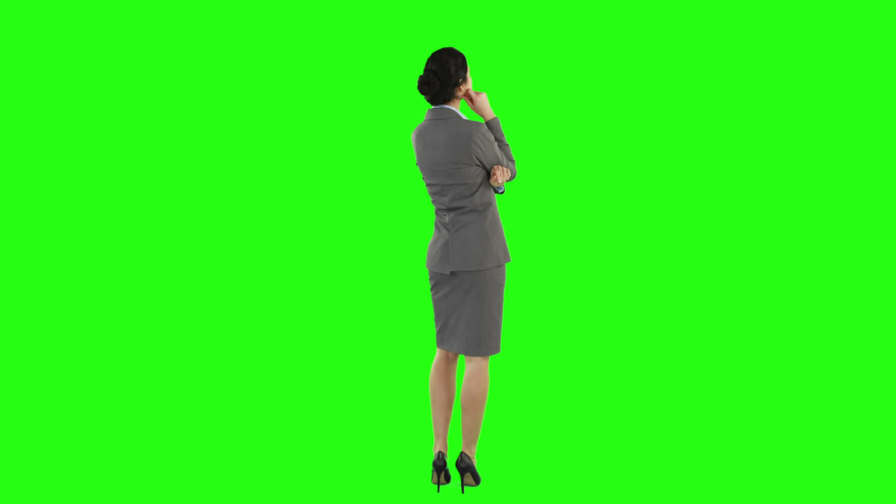 Business woman standing and looking around
