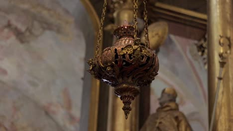 ornate historical censer hangs in the roman catholic church of st