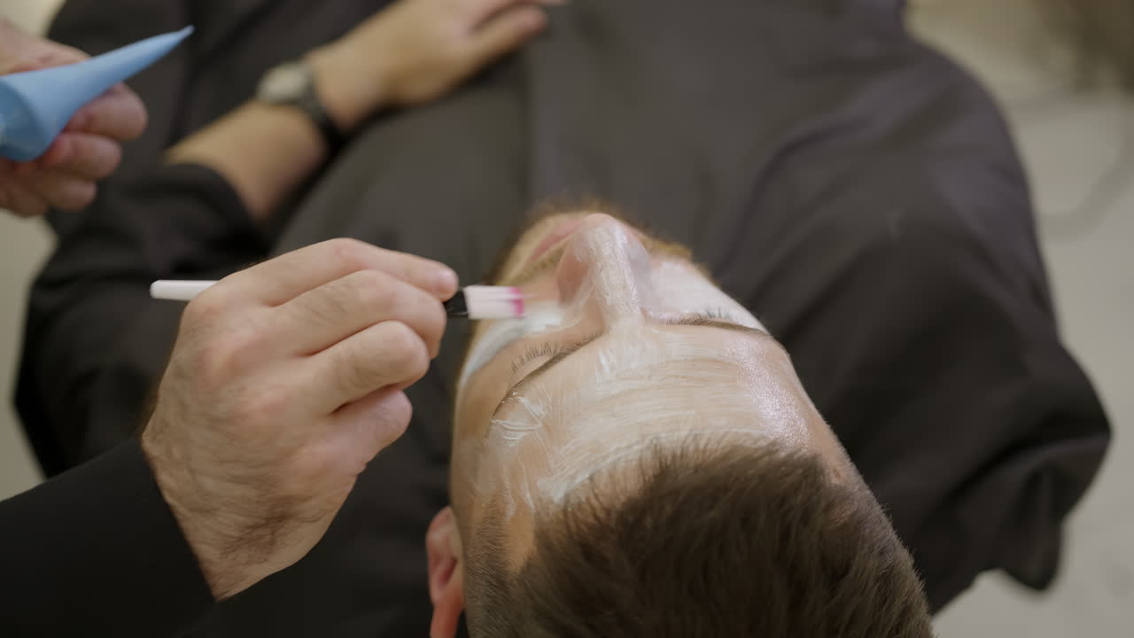 Man receiving a facial beauty treatment