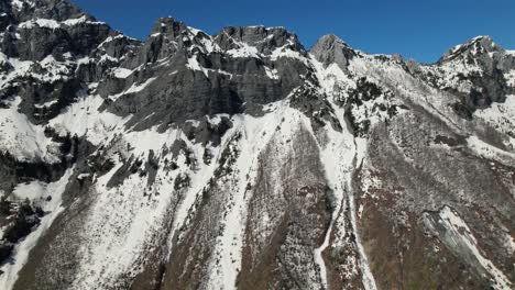 mountain rocky peaks covered in snow, beautiful albanian alps in spring