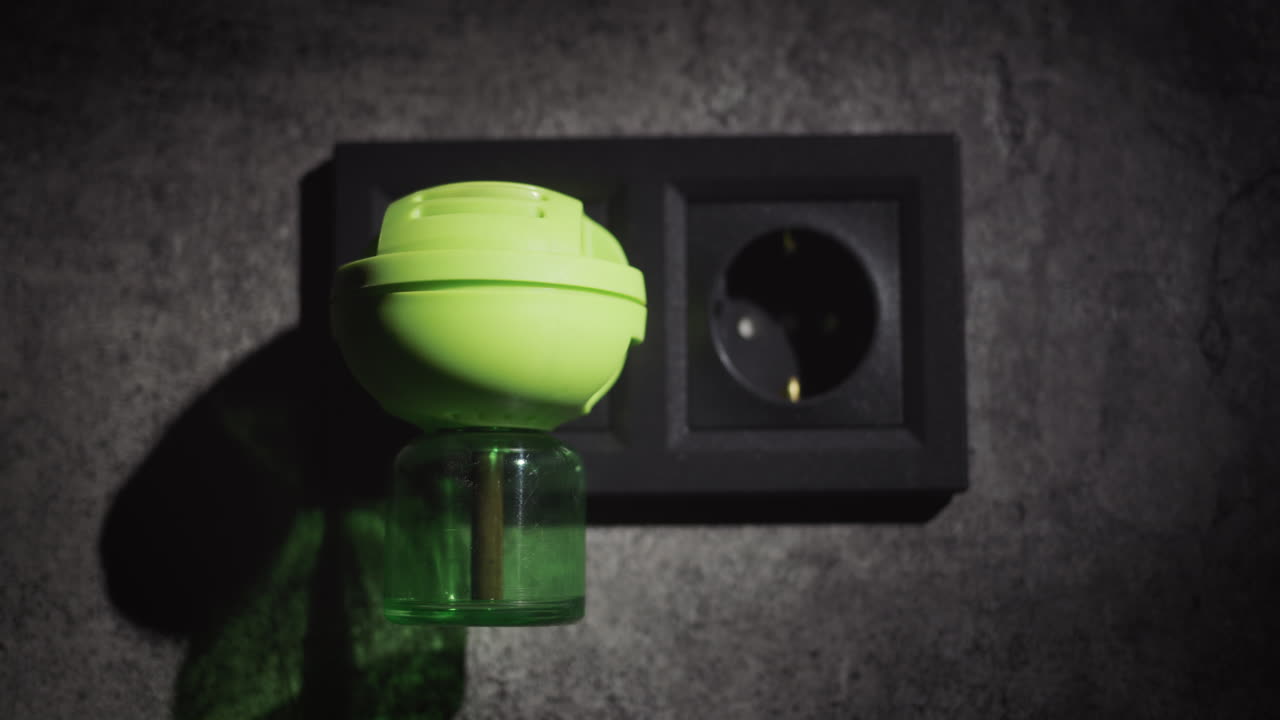 A device for killing mosquitoes in the house. Electric fumigator. 4k video