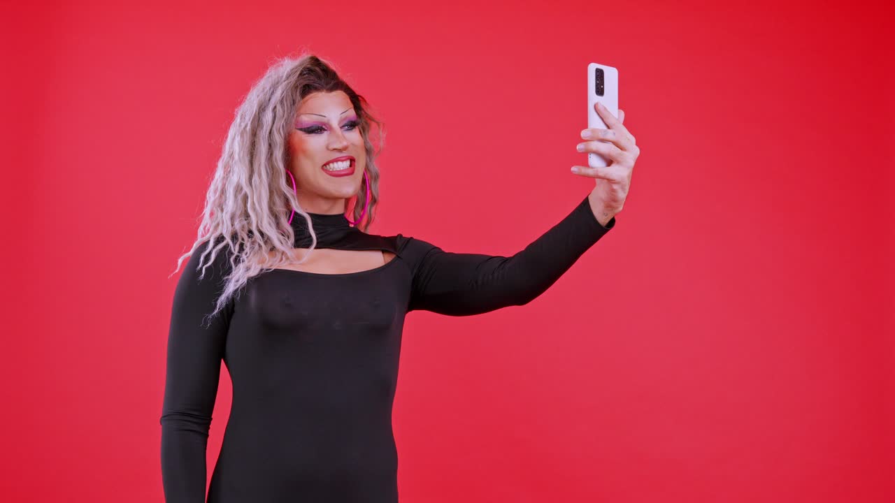 Drag Queen Taking Expressive Selfies with Smartphone