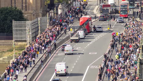 traffic and people crossing westminster bridge london