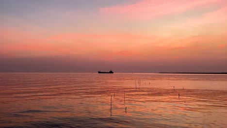 serene sunset view with a distant ship