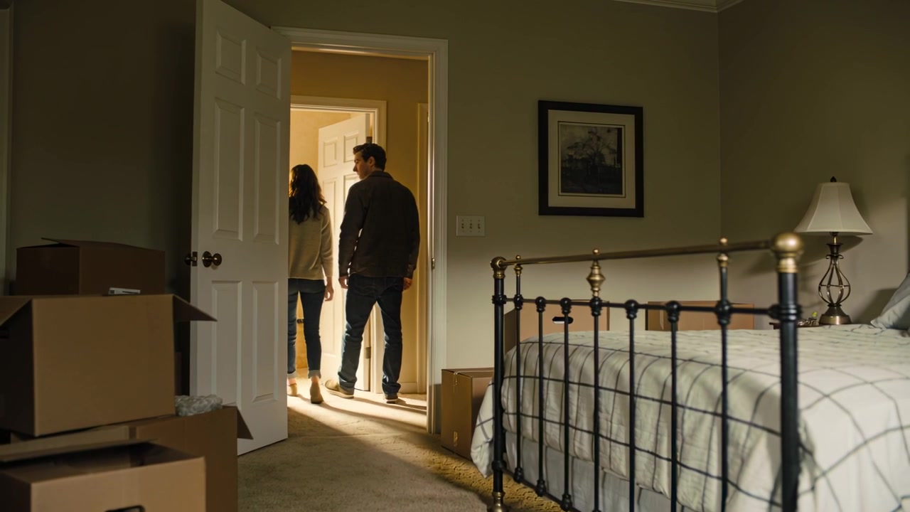 Walking couple stepping out of bedroom after door opening, moving out past stacked boxes and bed