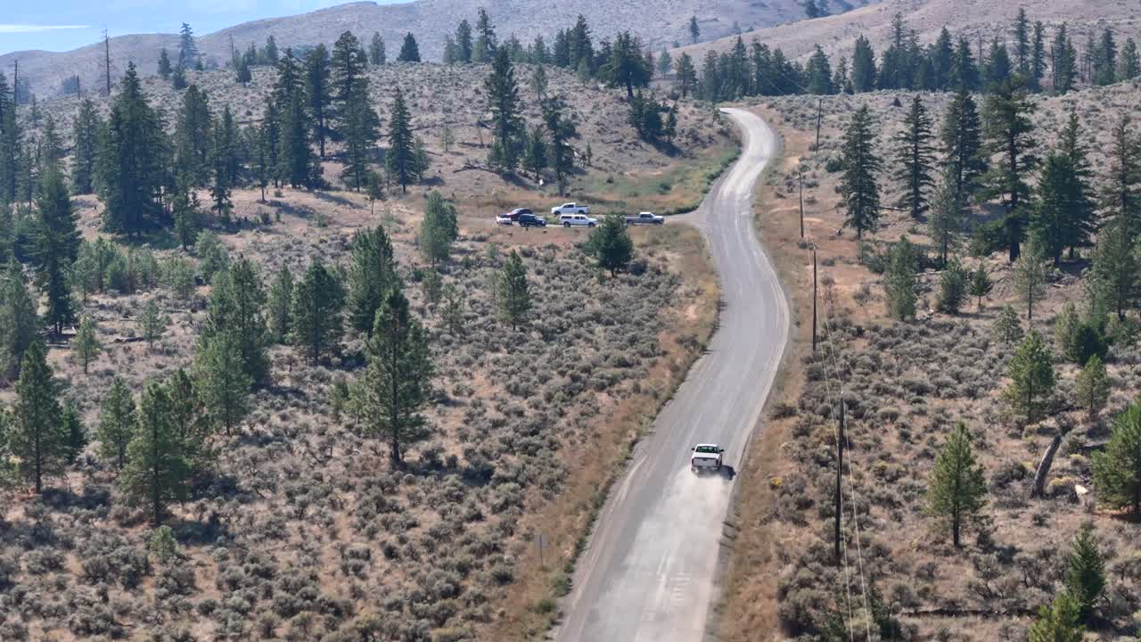 Bird's-Eye View of Pickup Truck on Dusty Deserted Path Through the Forest