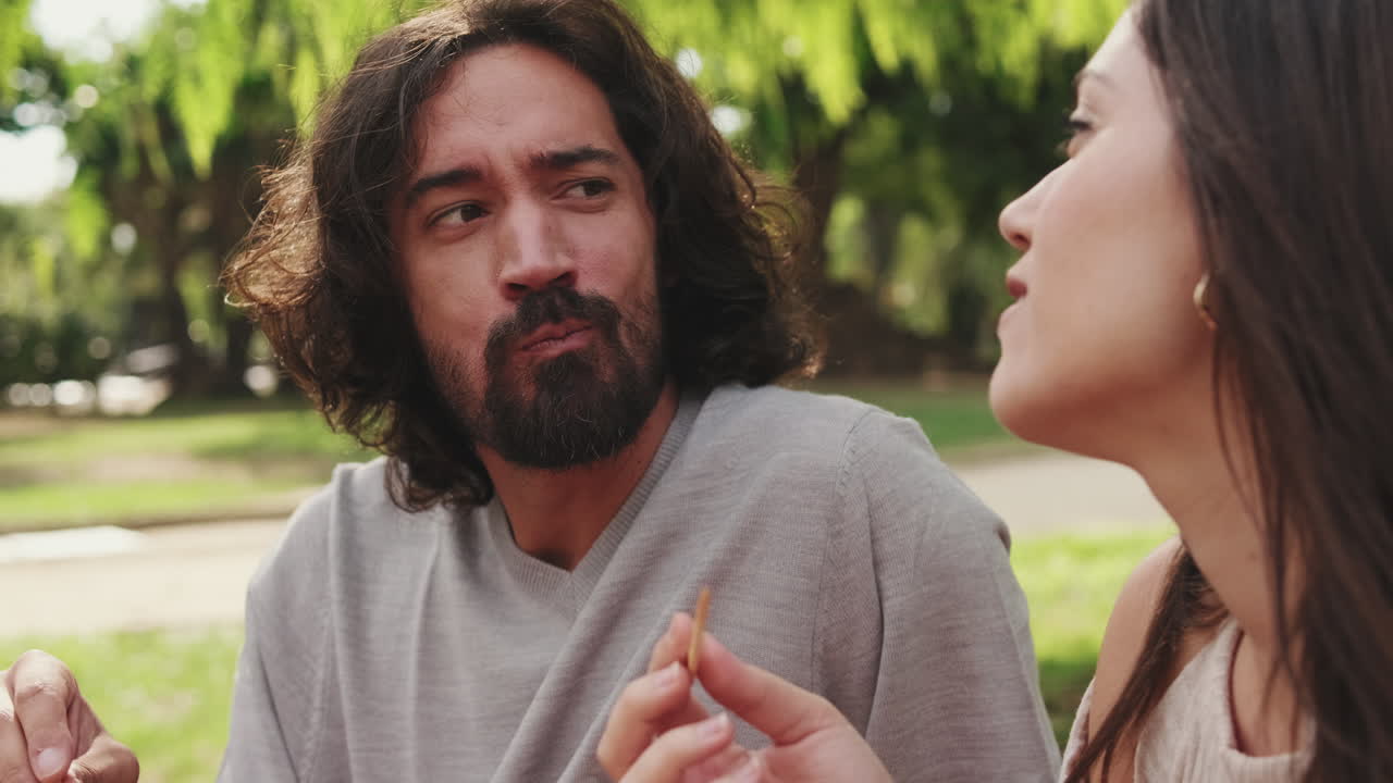 Couple eating outdoors