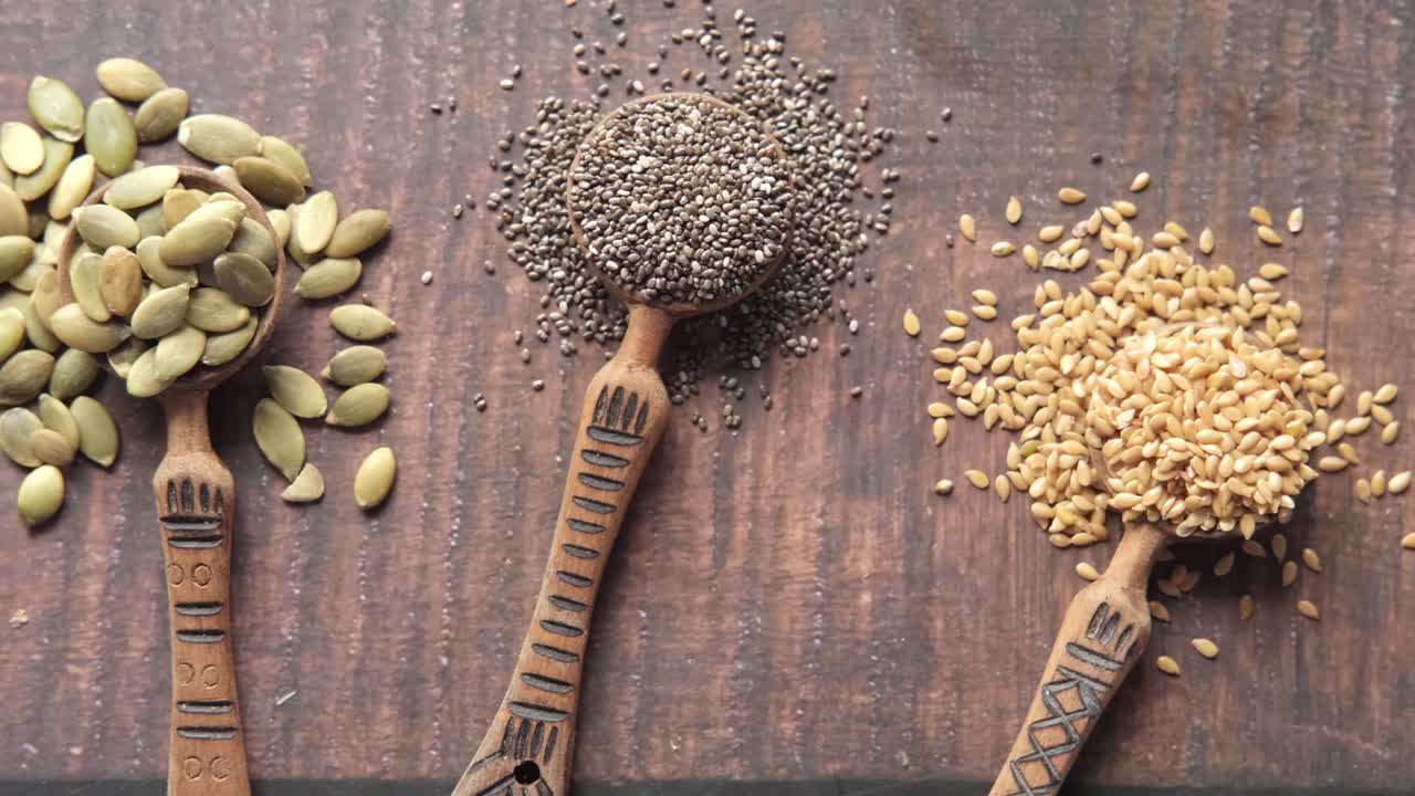 Assortment of Seeds in Wooden Spoons