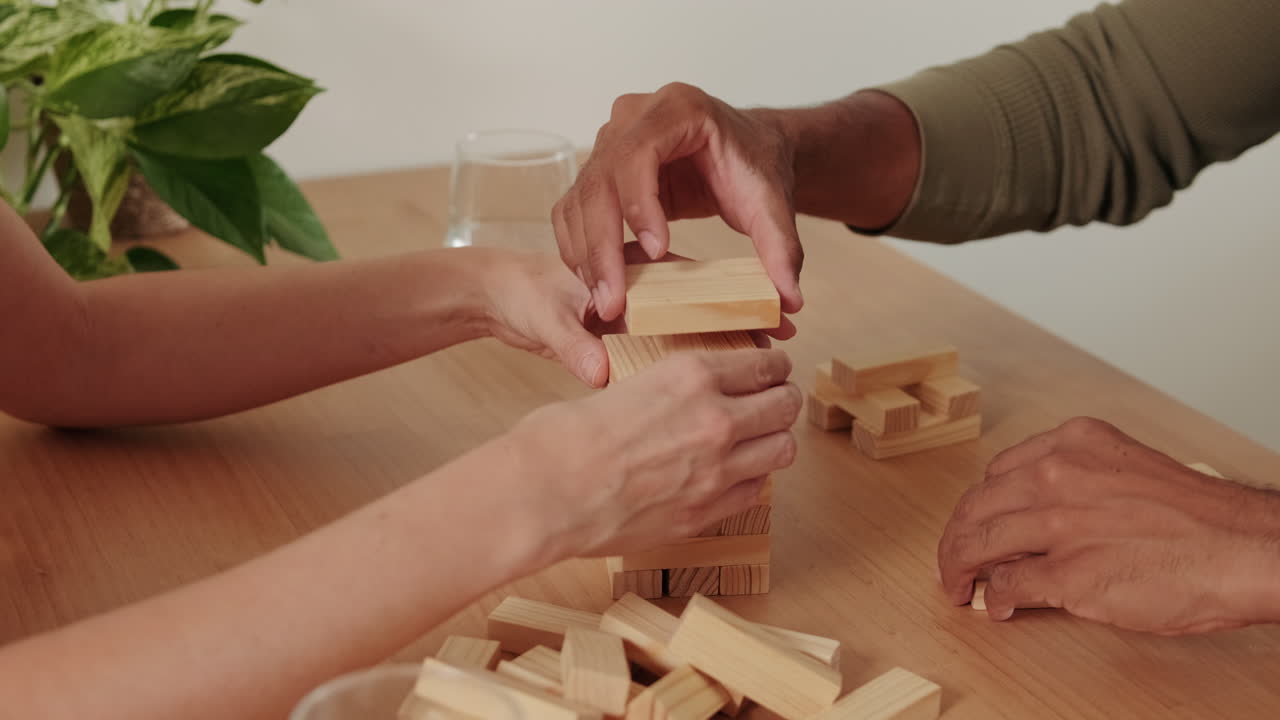 Couple Playing Jenga at Home