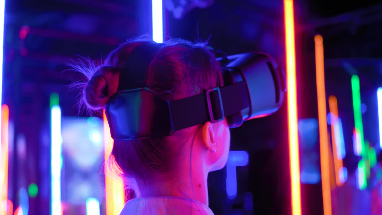 Back view: woman using virtual reality headset at interactive VR exhibition