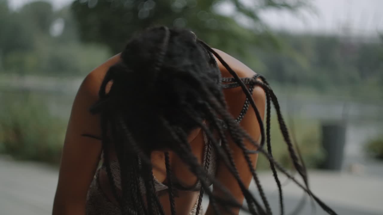 Woman with Braids in a Park