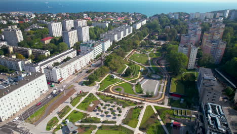 aerial - gdynia central park - a place full of greenery in the middle of the city - a wide panorama of the center of gdynia towards the gdańsk bay - residential buildings close to the greenery