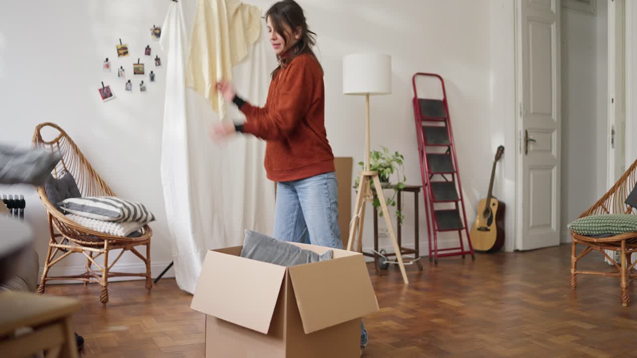 Woman unpacking boxes in a new home