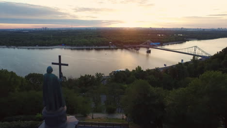 aerial view monument prince vladimir with cross on evening kiev city landscape