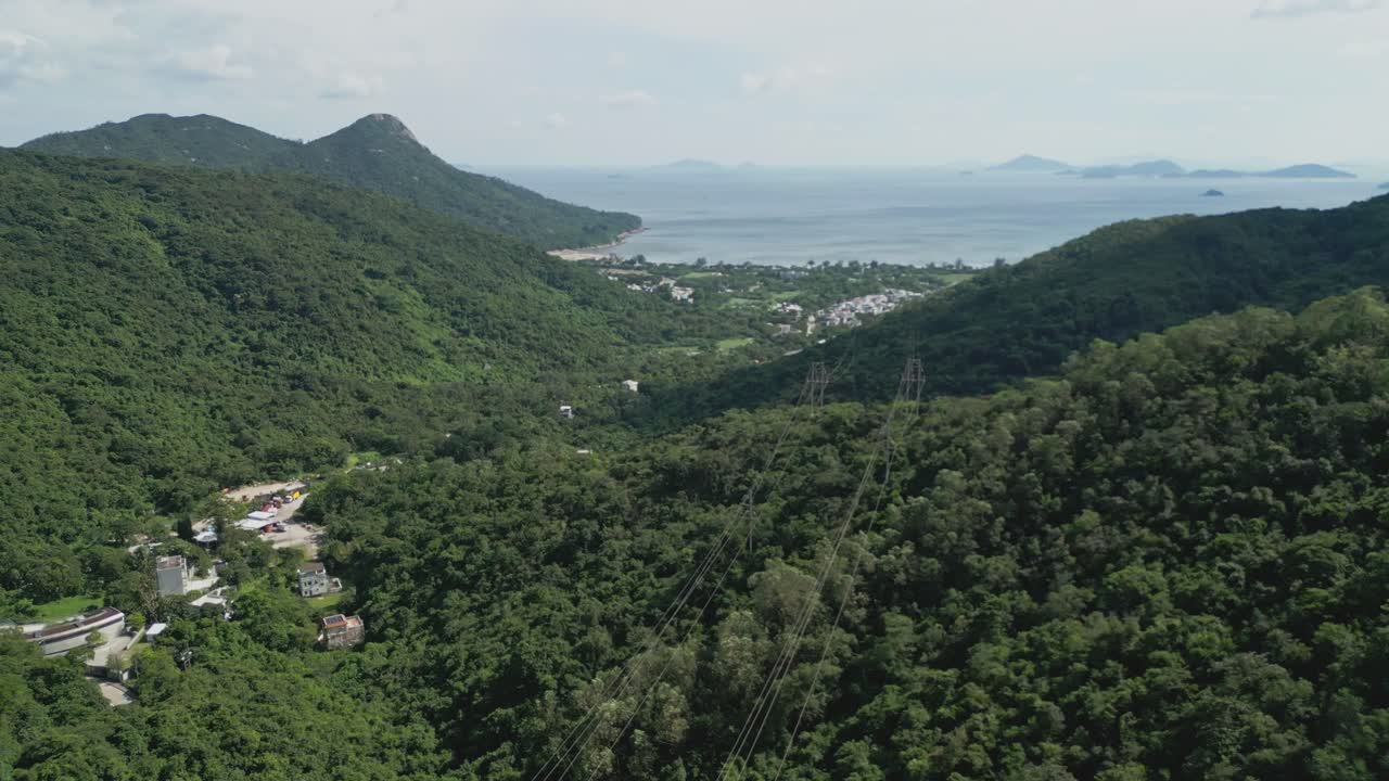 Footage of Mui Wo, a rural town on Lantau Island in Hong Kong, featuring coastal scenery, traditional buildings, lush greenery, and the serene lifestyle of this eastern coastal town