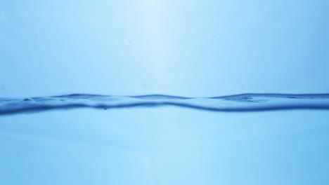 Water-waves-on-surface-with-blue-background_slow-motion