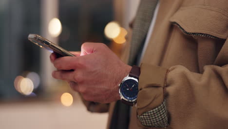 man using smartphone at night