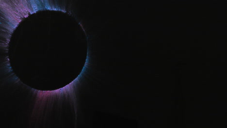 video of multi coloured powders with copy space and circle on black background