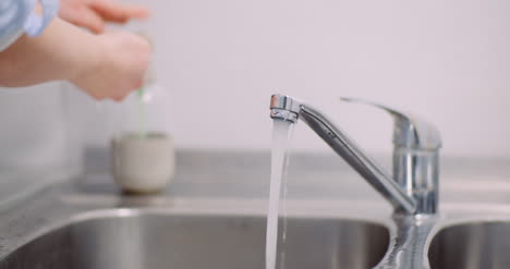 Female-Doctor-Desinfecting-Hands-At-Sink-2