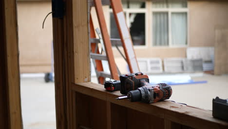 Power-tools-and-drill-on-the-lumber-framing-of-a-home-construction-site