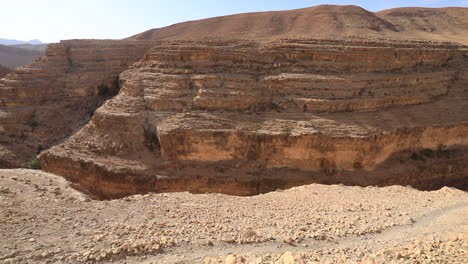 Sweeping-view-of-the-Canyon-of-Mides-under-bright-sunlight-in-Tunisia,-showcasing-the-arid-landscape-and-stratified-rock-formations