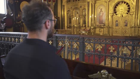 man worshiping in church.