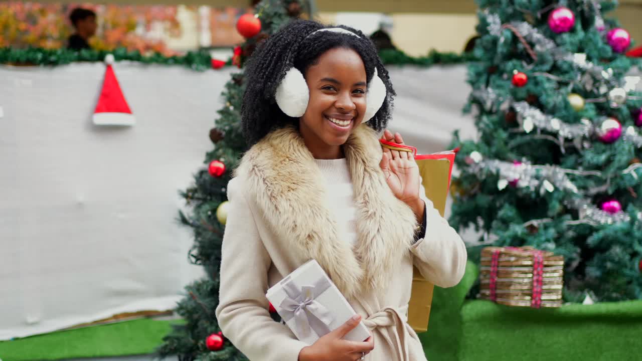 Woman holding Christmas gifts