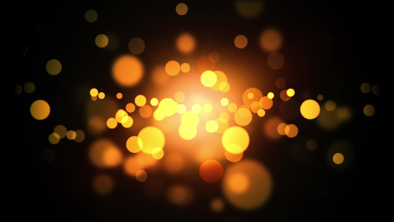 4K Abstract blurred light element beautiful gold bokeh with glittering flare light center on black background for cover decoration or holiday Christmas and Happy new year background.