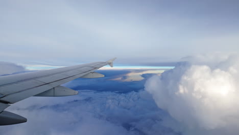 airplane wing view above clouds at sunset evokes adventure and calm