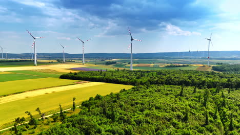 wind turbines producing clean energy. wind turbines tower over lush fields, showcasing renewable energy generation amidst a scenic countryside landscape