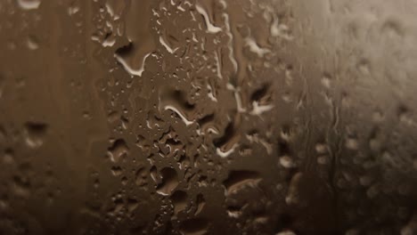 rain droplets texture with water abstract shapes on window glass reflecting light