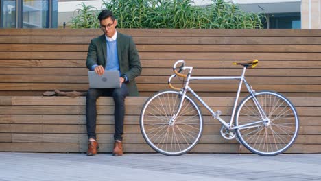 businessman using laptop on street 4k