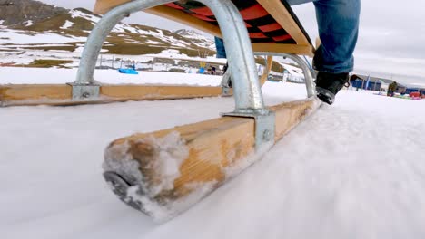 sledding down a snowy hill