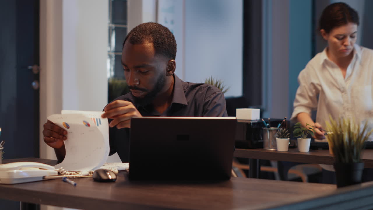 Disruptive confident manager analyzing financial data on and sales