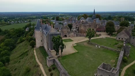 receding aerial movement from the medieval saint suzanne castle and belvedere, mayenne, france.
