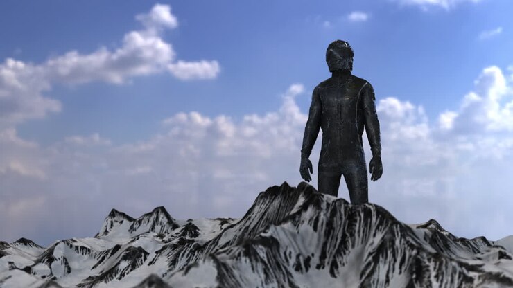 A person standing on a snowy mountain peak.