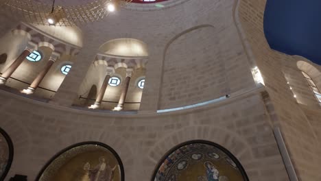 arched ceilings and detailed stone carvings inside dormition abbey. slow motion.