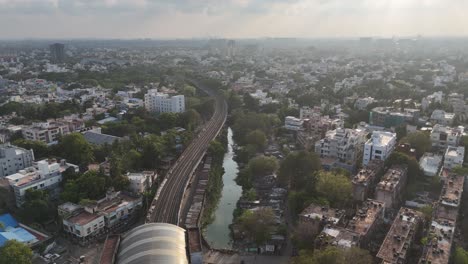 aerial footage of the evolving chennai cityscape with local railway track