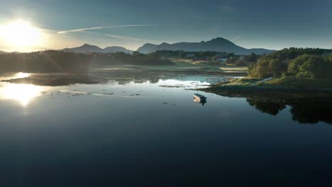 A-serene-aerial-view-of-a-calm-morning-lake-featuring-a-lone-boat