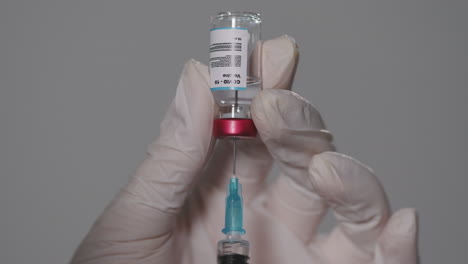syringe with covid-19 vaccine