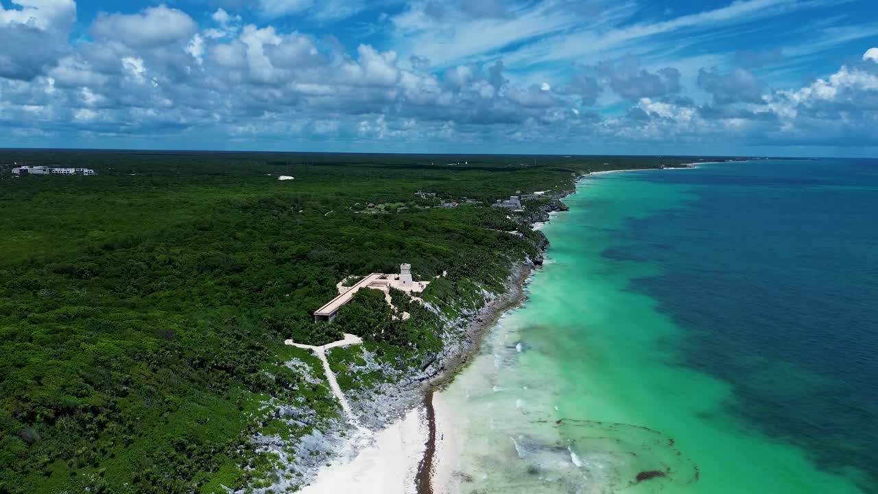 Drone aerial landscape of Tulum ruins lookout headland coastline ocean sandy beach stretch with rainforest Quintana Roo Central America Mexico travel tourism holidays