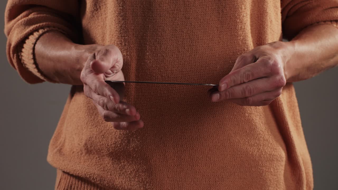 Retro Vinyl records in man hands close-up macro. Old disck for music. Retro vintage music player at home