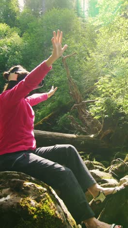 woman experiencing vr in a forest