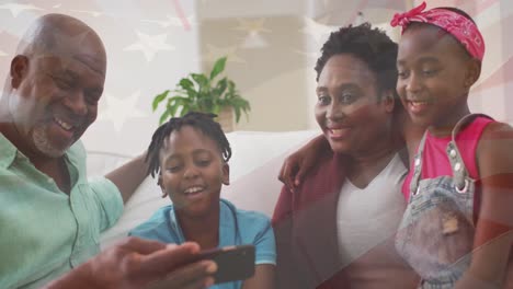 Animation-of-usa-flag-over-happy-african-american-family