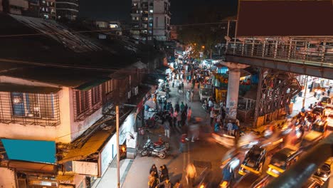 timelapse of a small busy walking street in mumbai at night