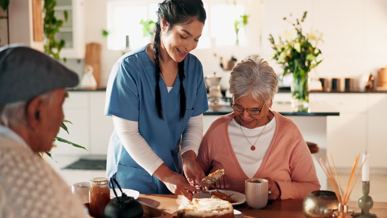 A young woman helps an elderly woman to eat cake