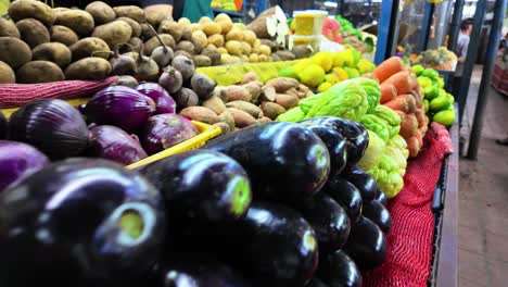 close up vegetables and fruits on market stall.carrots, eggplants, sweet potatoes, lemons, cassava