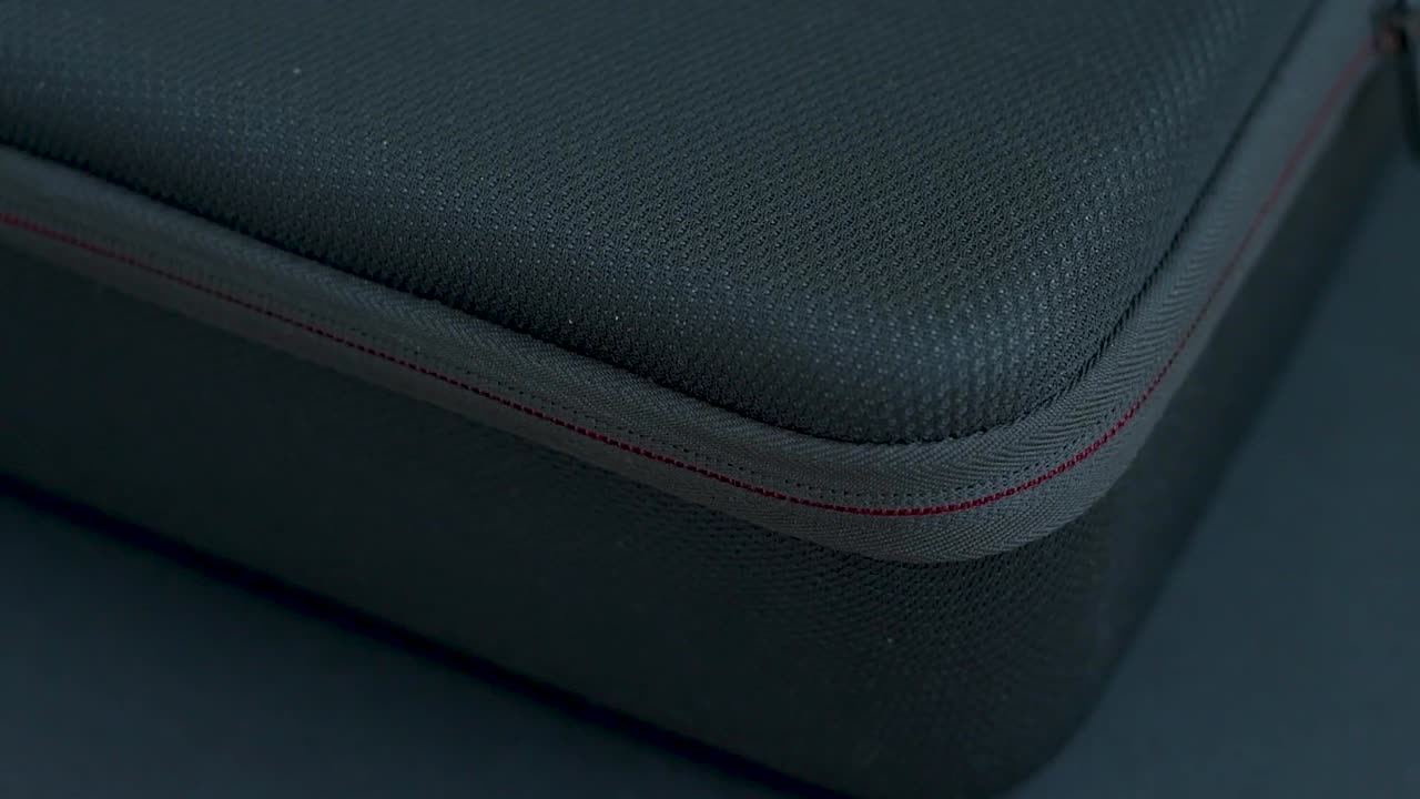 Close-up of a Black Carrying Case with Red Stitching