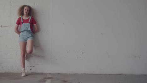 fashionable young woman in an abandoned warehouse