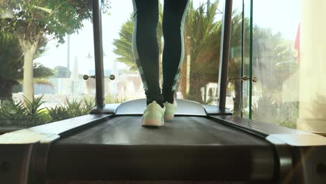 woman running on treadmill in gym. ealthy lifestyle.